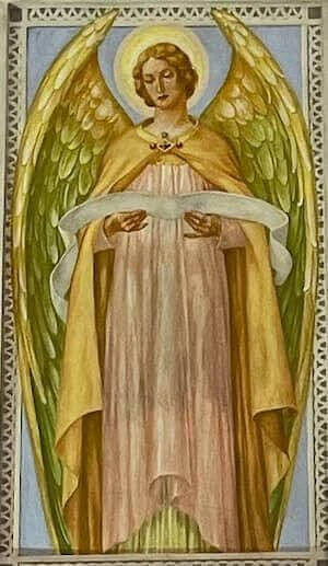 Angel holding a long sheet of music