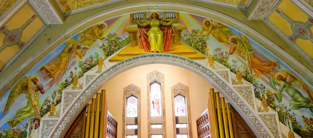 Saint Cecilia and angels above the organ at Sainte-Amélie